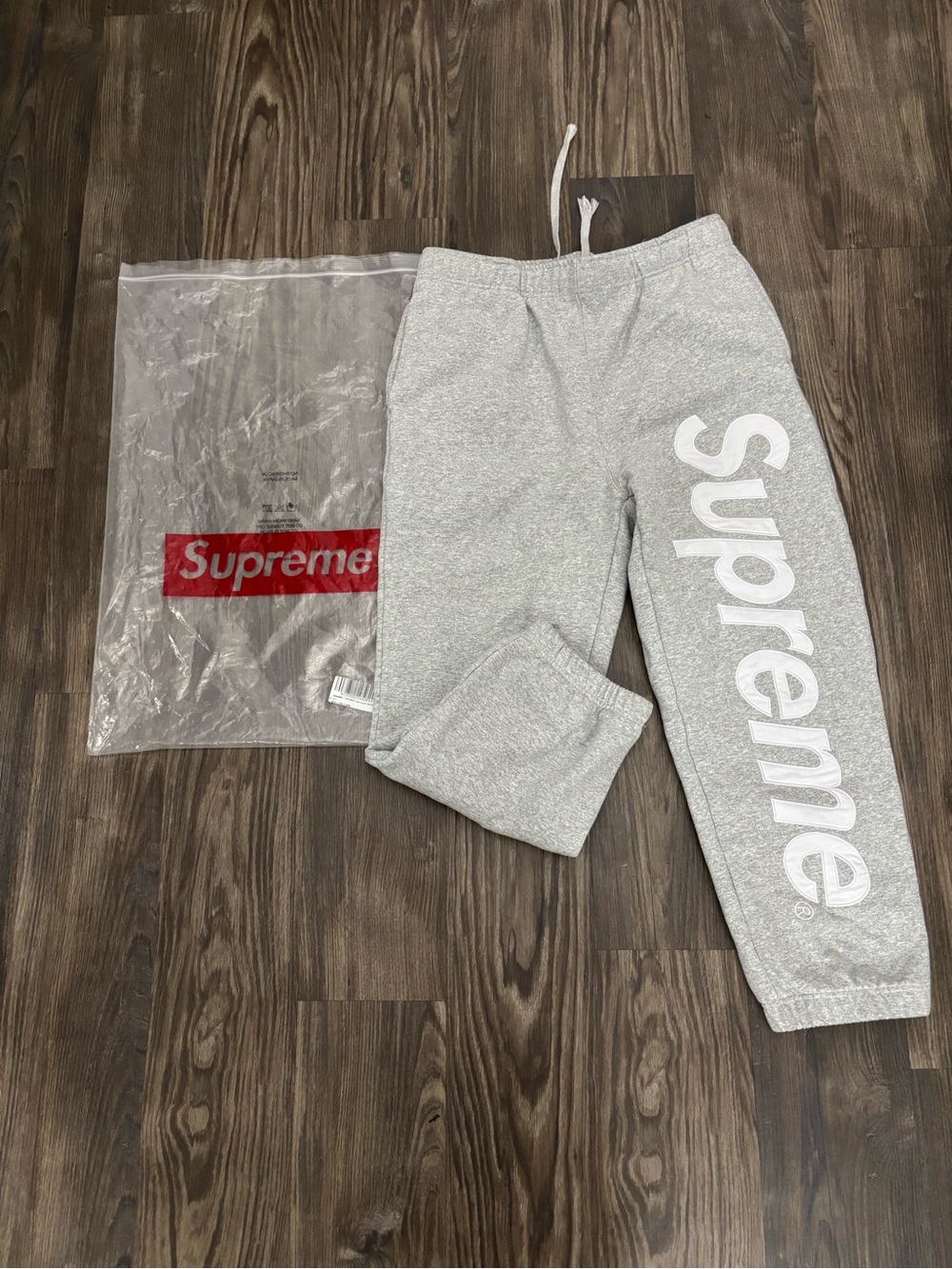 Supreme Kids Light Gray Sweatpants with White Vertical Logo